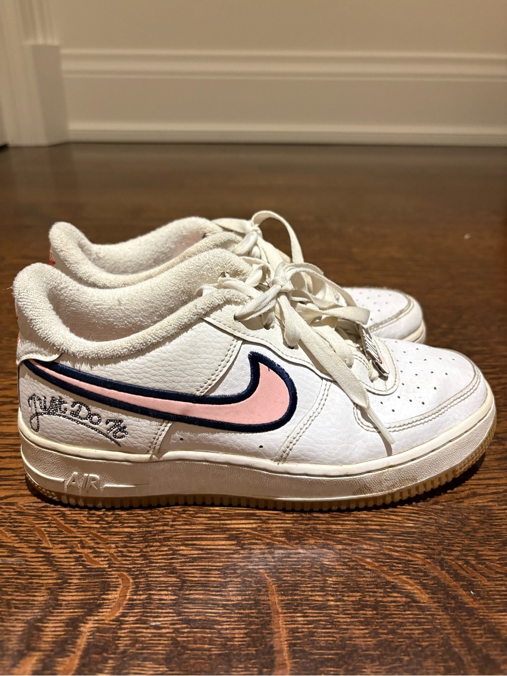 Nike White Low-Top Sneakers with Pink and Navy Swoosh